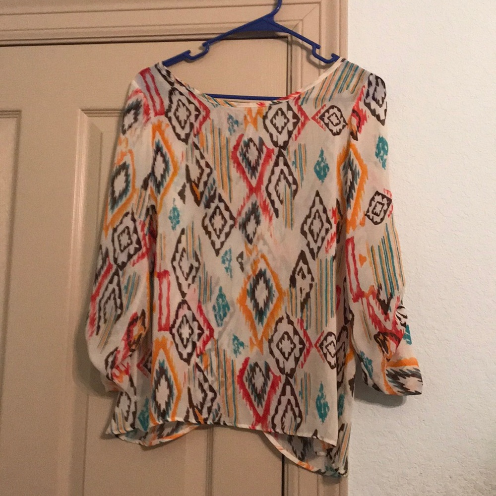 Multi-colored blouse. Worn once. Opening in back.